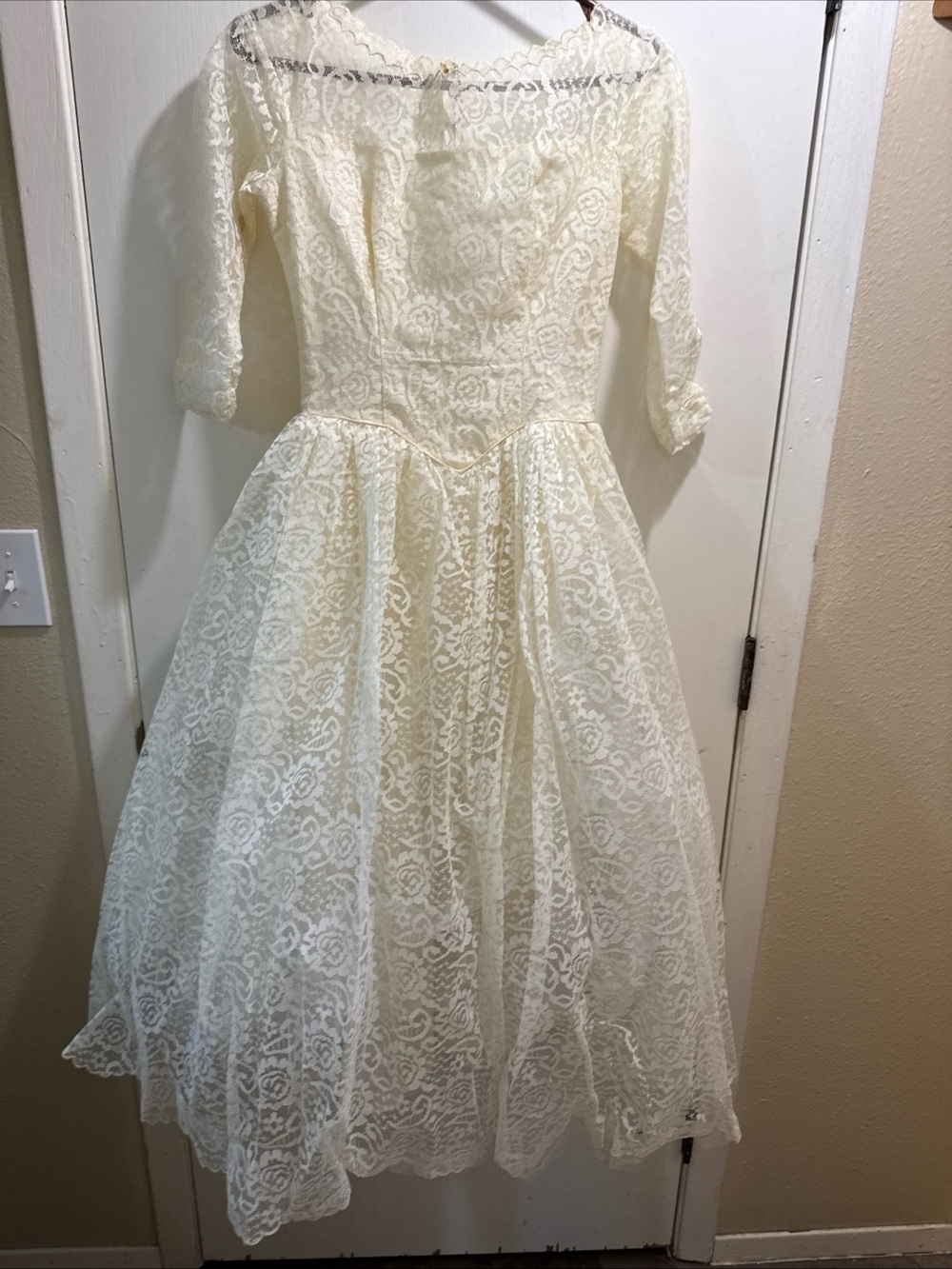 Ivory Lace A-Line Wedding Dress with Three-Quarter Sleeves